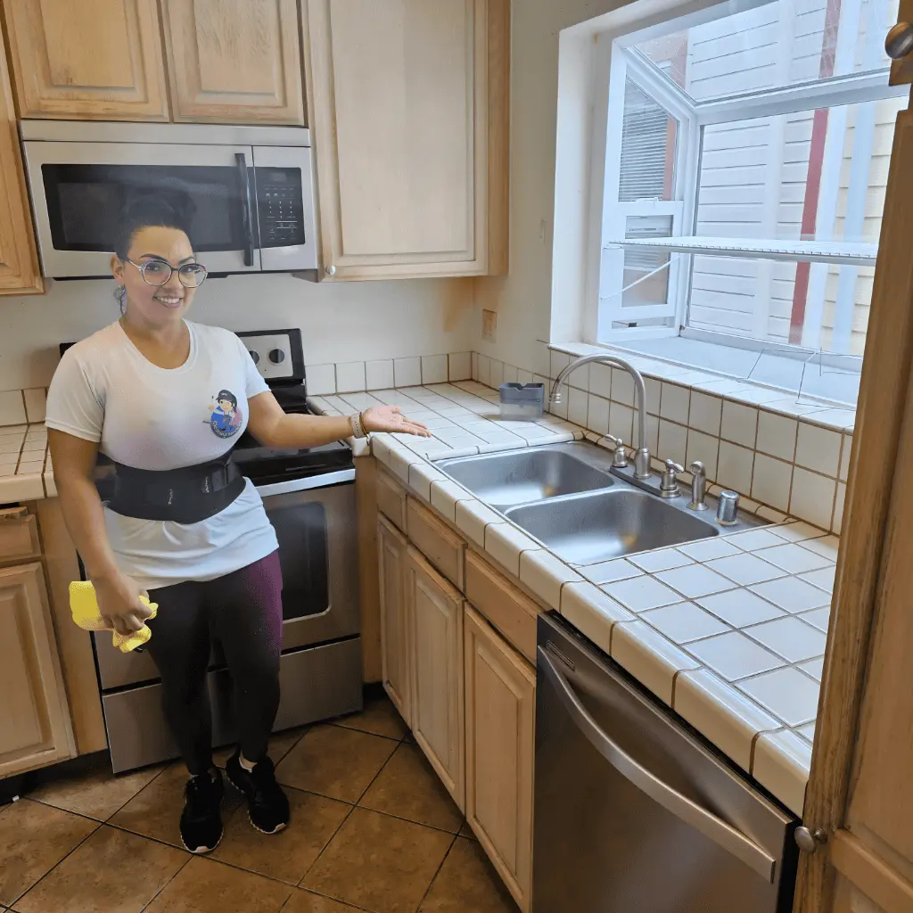 Kitchen sanitation by Lisa Cleaning Service disinfecting a sink